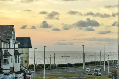 a view of the ocean and a parking lot at The Place by the Sea in Blackpool