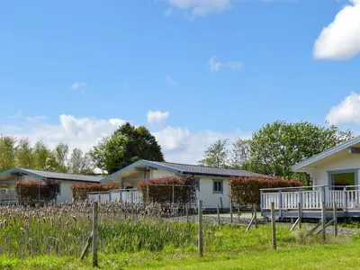 a house with a fence in front of it at Birch Lodge - Uk30006 in Lindal in Furness
