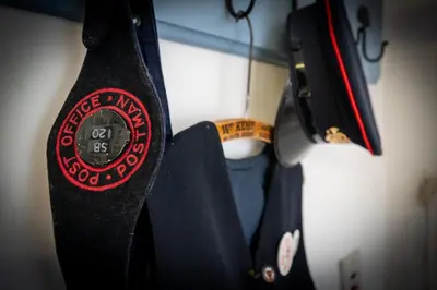 a close up of two ties hanging on a rack at The Old Post Office in Grange Over Sands