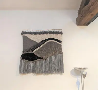 a rug hanging on a wall at Moss Tarn in Ulverston