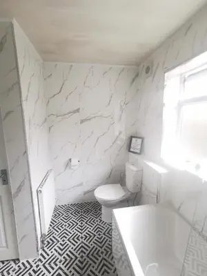 a white bathroom with a tub and a toilet at 4 Bedrooms, Sleeps 10, Near LFC & EFC in Liverpool