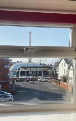 a view of a parking lot through a window at Aparthotel Blackpool in Blackpool