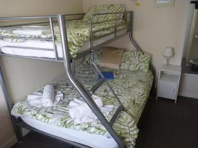 a room with two bunk beds with towels on them at The Berkswell in Blackpool