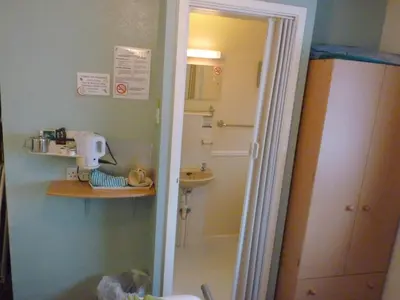 a small bathroom with a sink and a toilet at The Berkswell in Blackpool