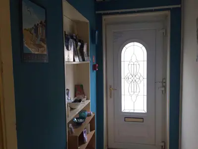 a white door with a window in a room at MyRoomz New Discovery Hotel in Blackpool