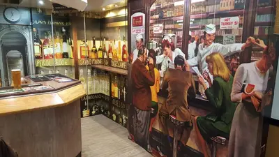 a bar with a painting on the wall at The Regal Hotel in Blackpool