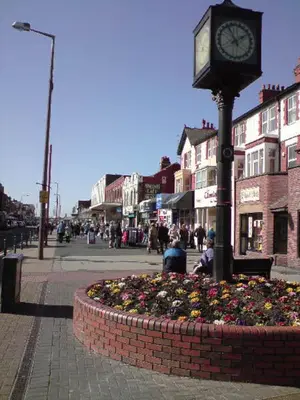 a clock on a pole on a city street at The Regal Hotel in Blackpool