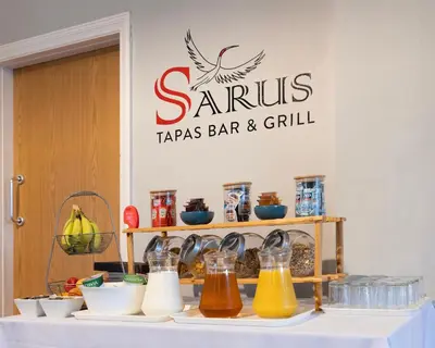 a table with some condiments on top at Orrell Park Hotel in Liverpool