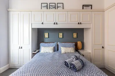 a bedroom with a bed with two pillows on it at Beach Lookout - SEA VIEWS in Lytham St Annes