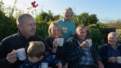 a group of people holding coffee cups in their hands at Orchard Glamping in Catterall