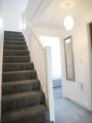 a staircase in a house with a mirror at The Kipling Inn, 4 - Bed, Sleeps 7, Pets Welcome in Ulverston