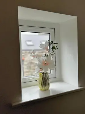 a vase with flowers sitting on a window sill at The Kipling Inn, 4 - Bed, Sleeps 7, Pets Welcome in Ulverston