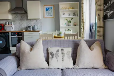 a couch with pillows on it in a kitchen at Modern central Penthouse - 1 FreeParking in Liverpool