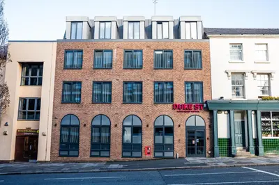 a brick building with windows on a street at Duke Street Boutique Hotel in Liverpool