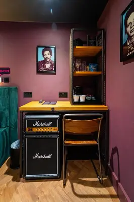 a bar with a table and a chair in a room at Duke Street Boutique Hotel in Liverpool