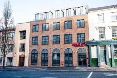 a brick building with windows on a street at Duke Street Boutique Hotel in Liverpool