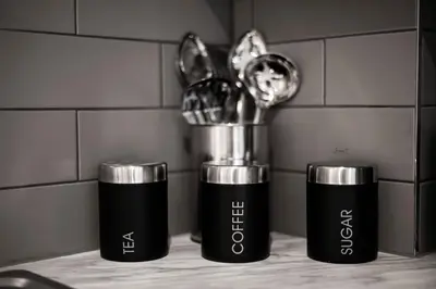 two cups sitting on a counter in a kitchen at Charles Alexander Short Stay - Windmill House Apartments in Lytham St Annes