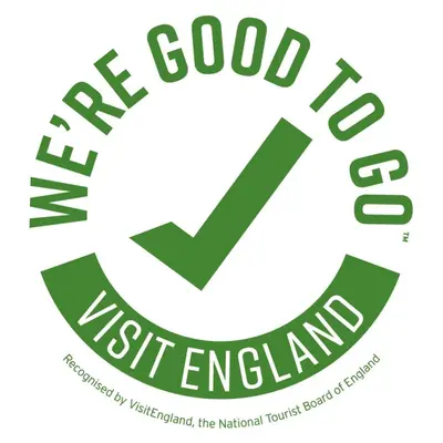 a logo for the good to assist england at FSC Castle Head Hostel in Grange Over Sands