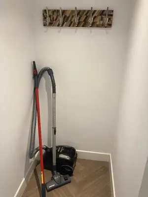 a vacuum cleaner in a corner of a room at Low Greenlands Holiday Park - Luxury House & Luxury Glamping Pods in Lancaster
