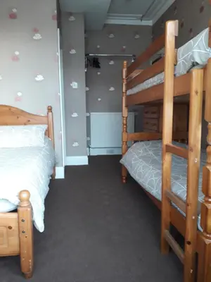 a bedroom with two bunk beds in a room at Witton house in Blackpool