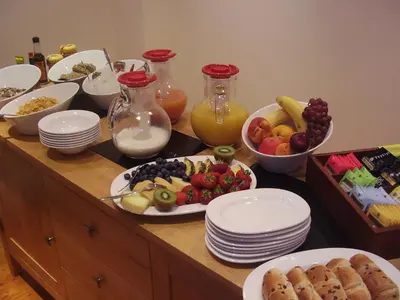 a table with plates of food and bowls of fruit at Langtrys in Blackpool