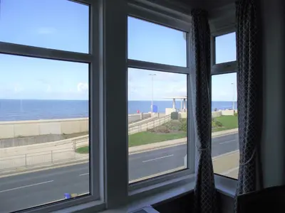 a window with a view of the ocean at Seahawk Holiday Apartments in Cleveleys