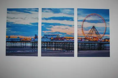 a group of four pictures of a pier with a ferris wheel at Albert Hottub & Jacuzzi Apartments in Blackpool