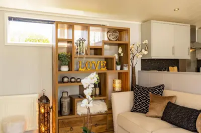 a living room with a couch and a table at Inside No. 1 Retreat in Carnforth