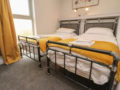 two bunk beds in a room with a window at Box Tree Escapes in Lancaster