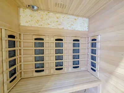 a sauna with wooden paneling and a ceiling at The Kings Landing Spa in Blackpool