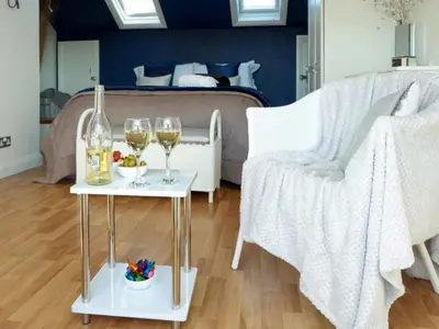 a bedroom with two tables with wine glasses and a bed at Wild Duck in Pennington