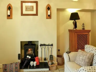 a living room with a couch and a fireplace at Wild Duck in Pennington