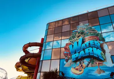 a water park sign on the side of a building at Chelsea Suite Sasco Apartments in Blackpool