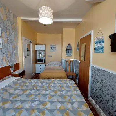 a bedroom with two beds in a room at THE ROCK n ROLL in Blackpool