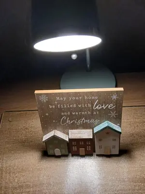 a toy house is sitting on a floor under a lamp at PONDEROSA B&B with free onsite parking and breakfast included in Blackpool