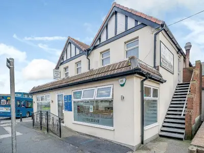 a store front of a building with a bus at Kays in Cleveleys