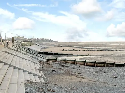 a view of the beach with people walking on the beach at Kays in Cleveleys