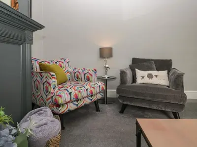 a living room with a chair and a chair and a couch at Number Thirty-Nine in Ulverston