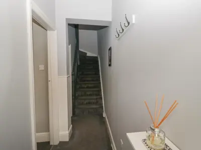 a hallway with a spiral staircase in a house at Number Thirty-Nine in Ulverston