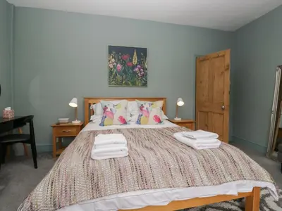 a bedroom with a bed with two towels on it at Number Thirty-Nine in Ulverston