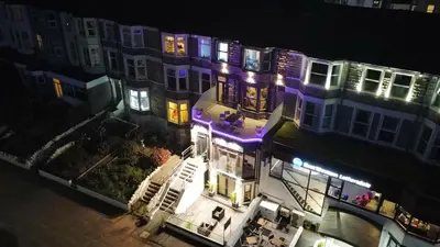 an overhead view of a building with purple lights at Eden Escapes Serviced Apartments in Morecambe
