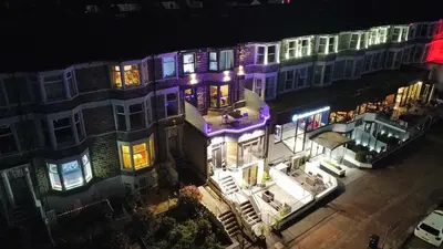 an overhead view of a building with purple lights at Eden Escapes Serviced Apartments in Morecambe