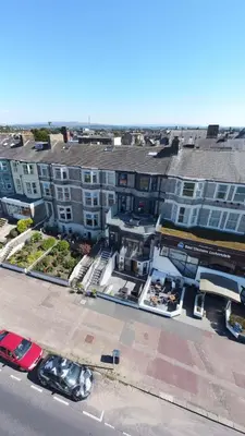 an aerial view of a building with a parking lot at Eden Escapes Serviced Apartments in Morecambe