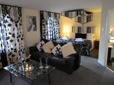 a living room with a couch and a bed at The Birley Arms Hotel in Preston