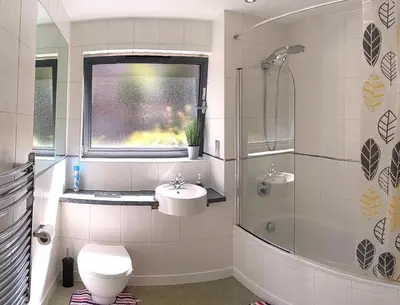 a bathroom with a toilet and a sink and a shower at Two-bedroom ground-floor apartment Self check-in in Liverpool