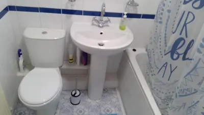 a bathroom with a white toilet and a sink at Cosy house for business travel and pleasure in Bickershaw