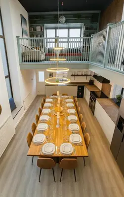 a large long table with chairs in a room at Onyx House in Blackpool