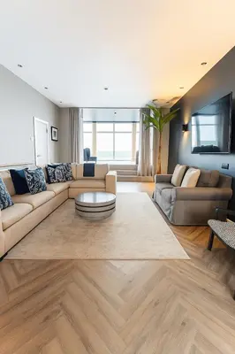a living room with a couch and a table at Onyx House in Blackpool