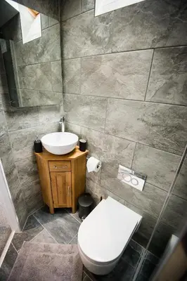 a bathroom with a toilet and a sink at Alpaca Fold in Preston