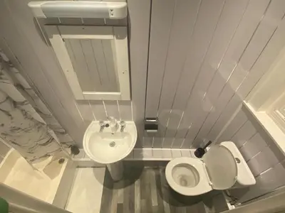 a small bathroom with a toilet and a sink at Northern Pearl Hotel in Blackpool